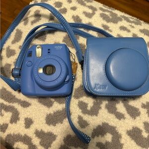Blue polaroid camera